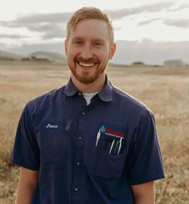 Photo of smiling technician in a field