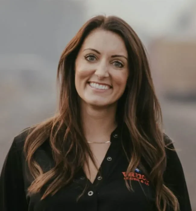 Photo Of Smiling Vance Technician With Branded Black Button Up
