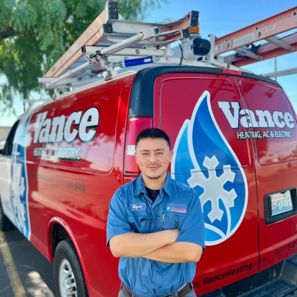 A Vance Technician Standing In Front Of A Technician Van
